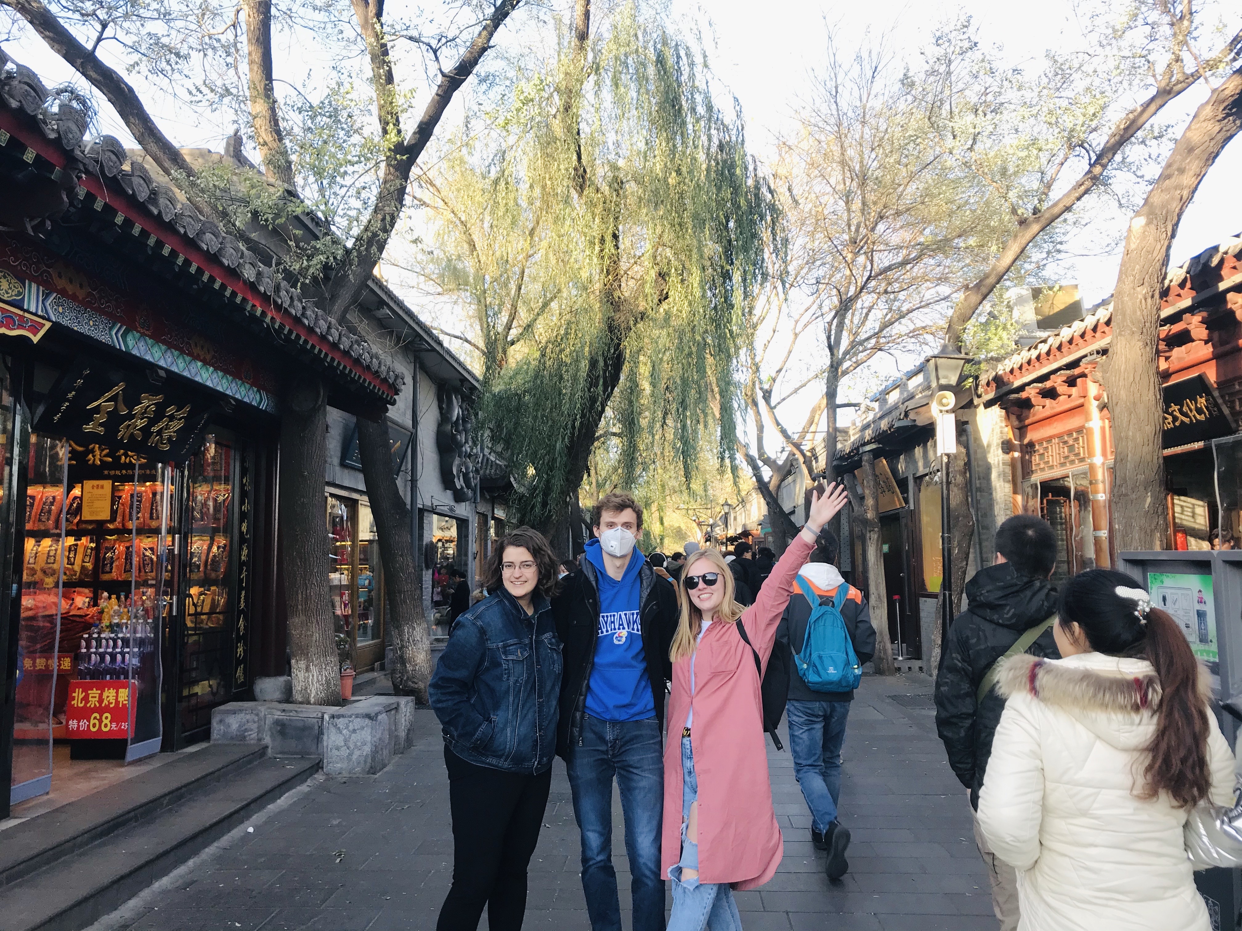 Friends posing in front of Hutong Alley