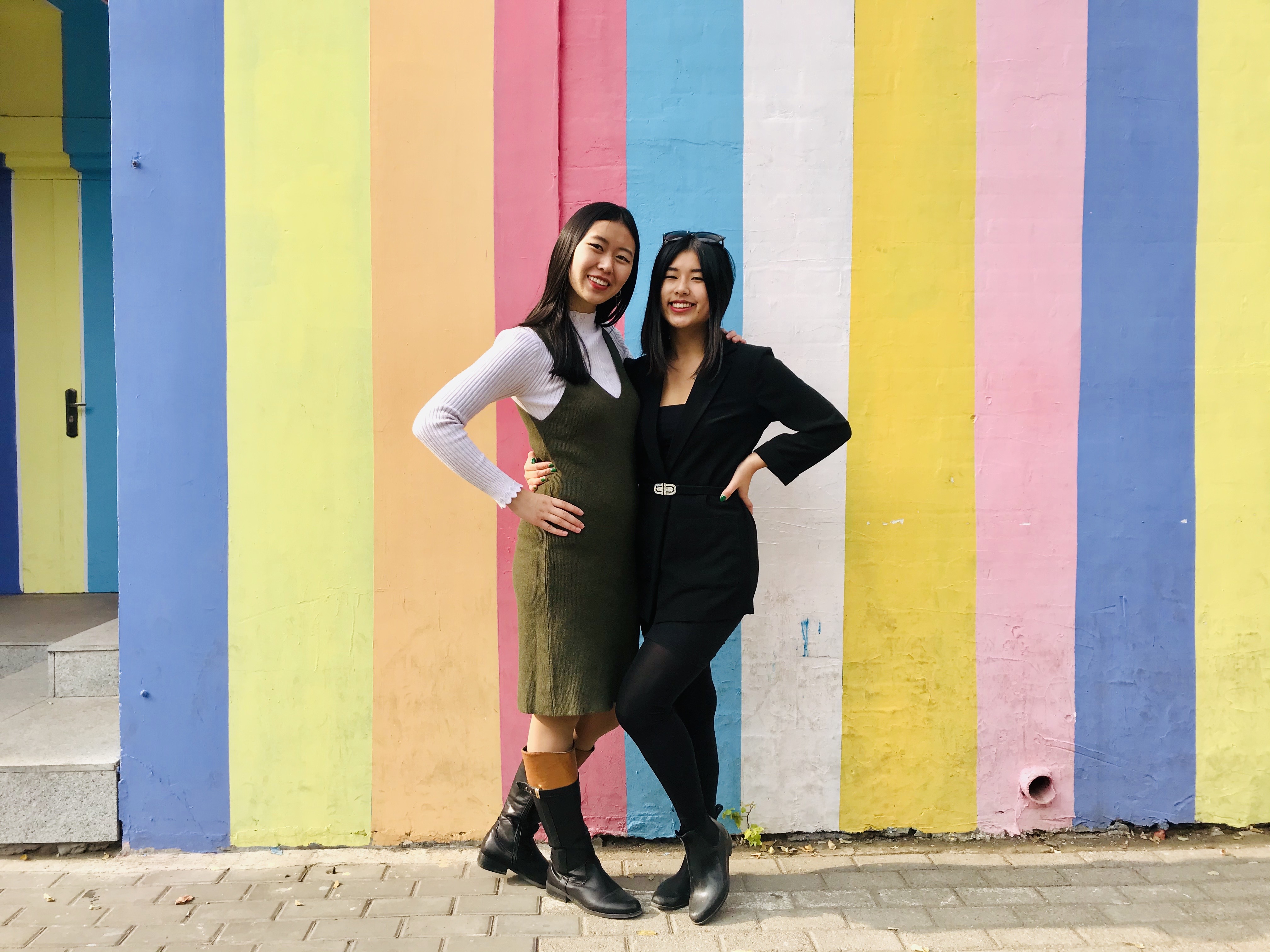 Sarah and I in front of a colorful wall