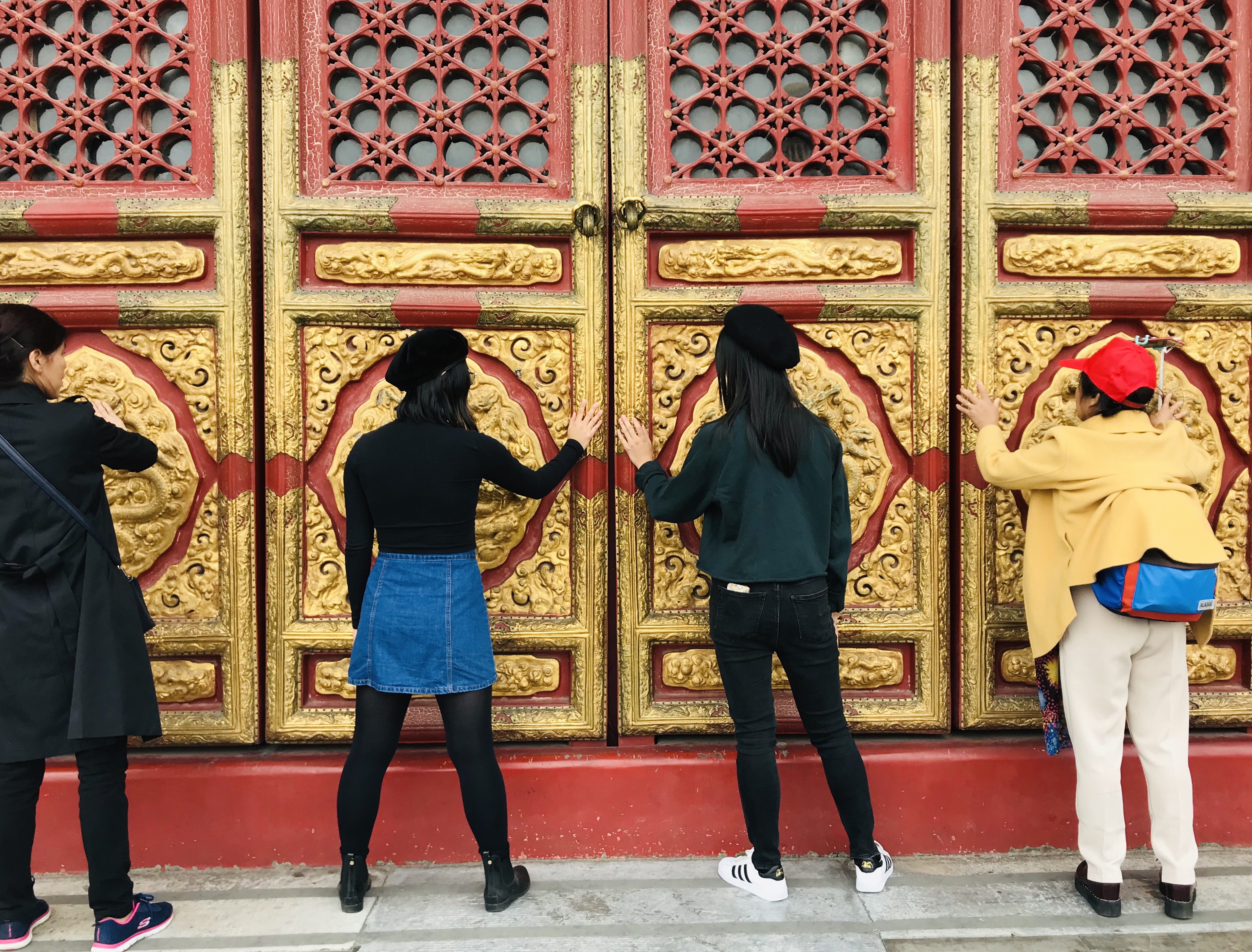 Sarah and I touching the Doors in the Forbidden City for blessings.