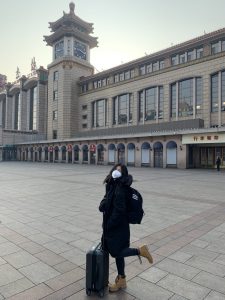 At the Beijing train station, me wearing my mask.