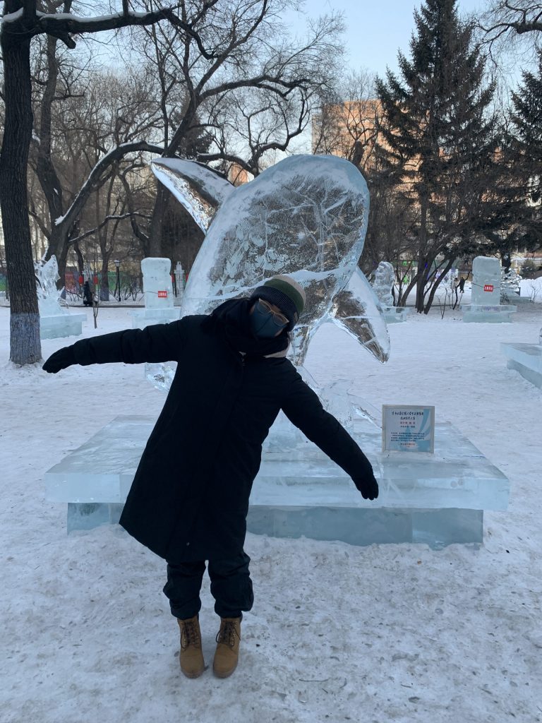 Posing with an ice sculpture 