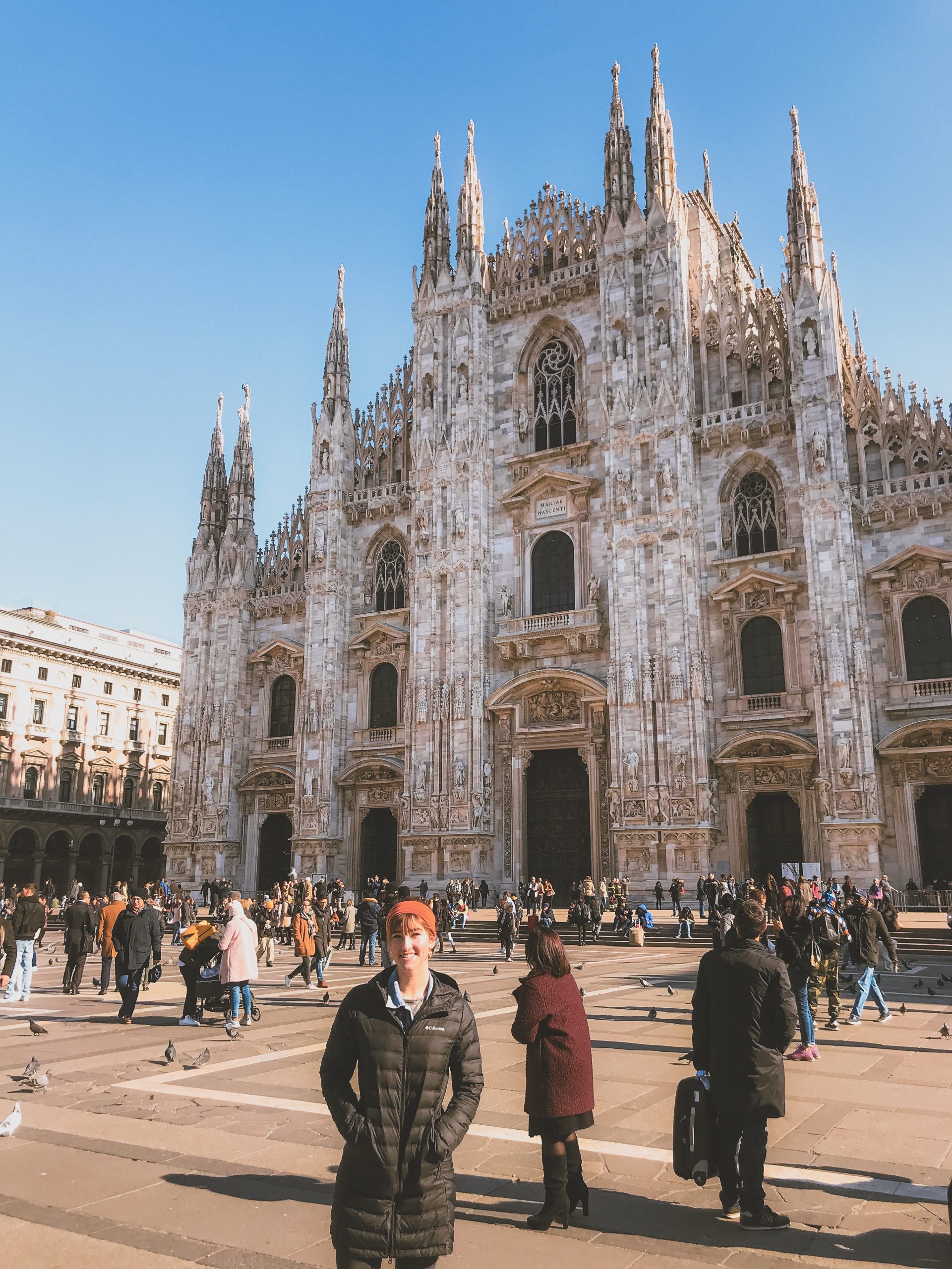 Girl standing in front of the Duomo in Milan, Italy.