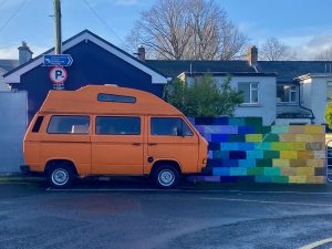 An Irish bus, orange in color.
