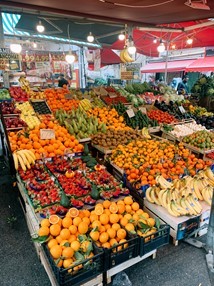 An array of vibrant fruits and vegetables at a stand in the market.Mercato di Ballaro, Palermo, Sicily.