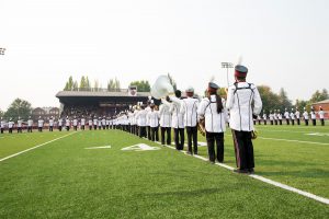 Tualatin High School Marching band lines up during Linfield football game
