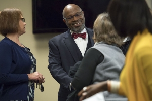 Linfield University president Miles K. Davis interacts with staff and faculty